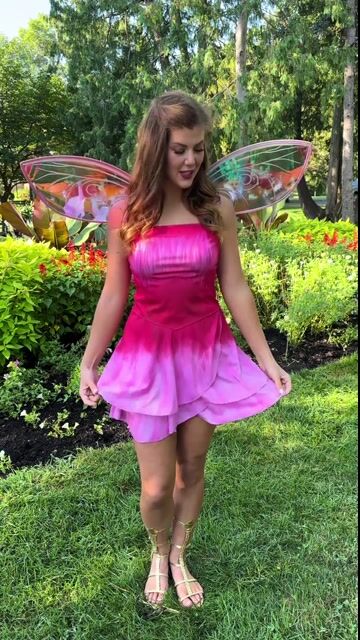 Step into the magical world of Pixie Hollow with our exclusive Women's Disney Fairies Rosetta Costume Dress. This look add a touch of fairy-tale charm to your celebration.