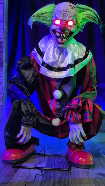 Add sinister circus vibes with the Crouching Clown Red Animatronic Decoration—perfect for creepy Halloween displays and haunted clown setups.