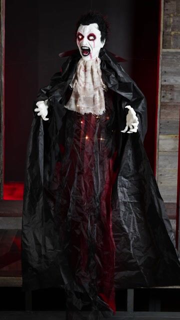 Making your Halloween feel extra fang-tastic when you get this exclusive 5FT Lucent Lucien Hanging Vampire Animatronic Decoration! After all, you can't spell Halloween without vampire, right?