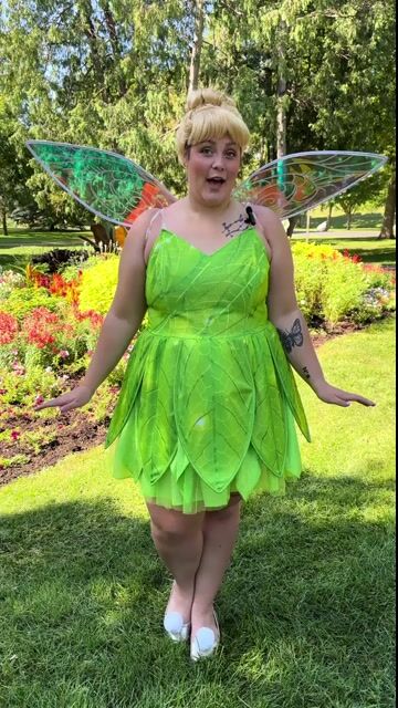 Transform into the beloved fairy from Neverland with this exclusive Women's Plus Size Disney Tinker Bell Costume! This enchanting outfit beautifully captures the magic of everyone’s favorite pixie.